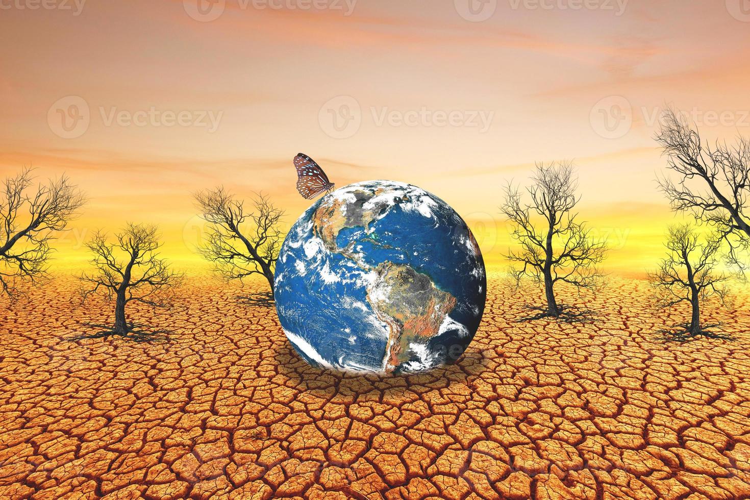 changing the environment globe on a barren land photo