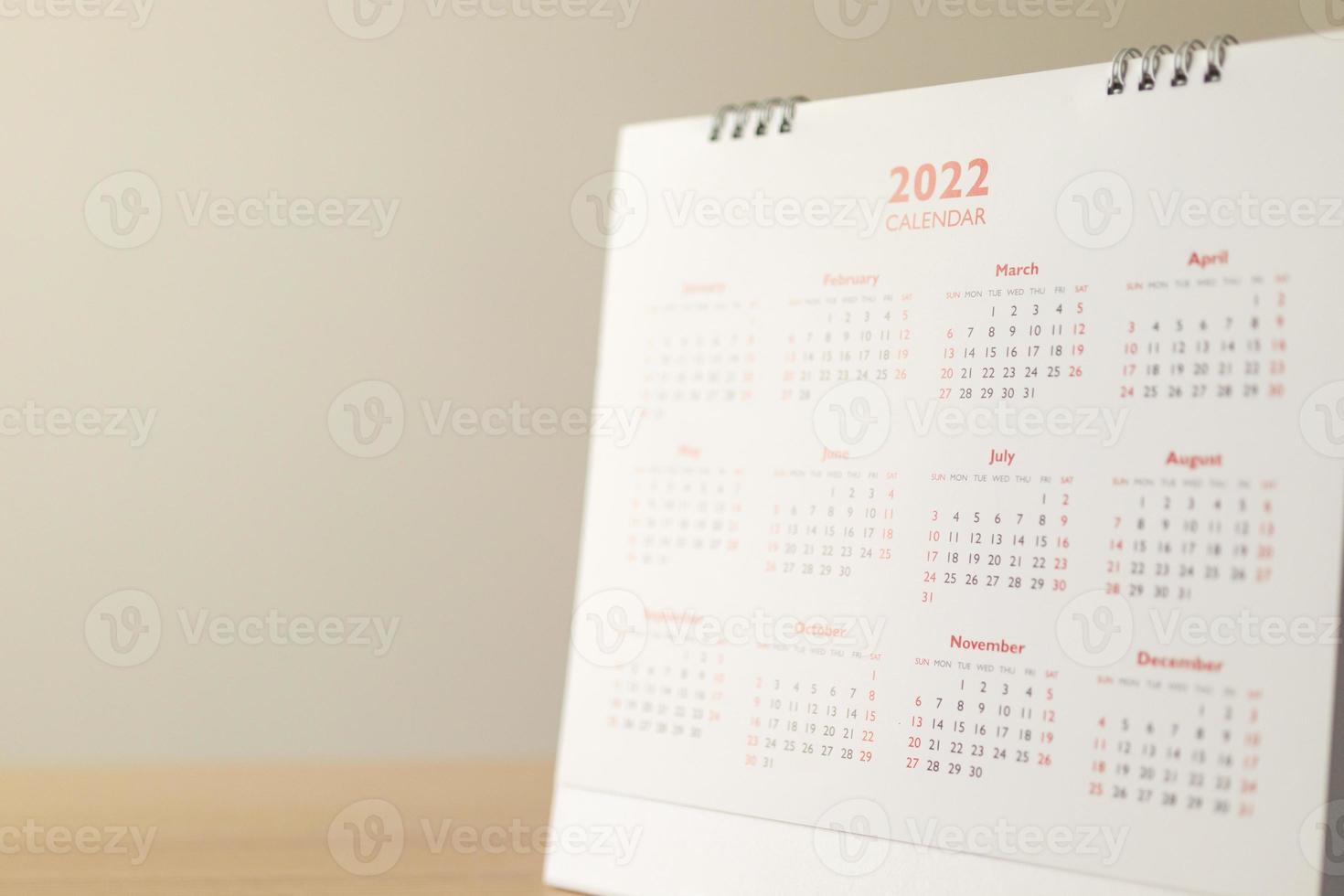 Close up 2022 calendar page dates and month background business planning appointment meeting concept photo