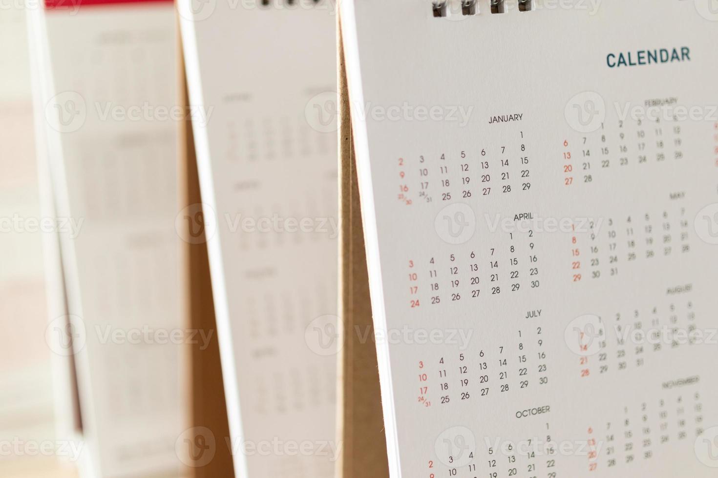 Close up calendar page dates and month background business planning appointment meeting concept photo