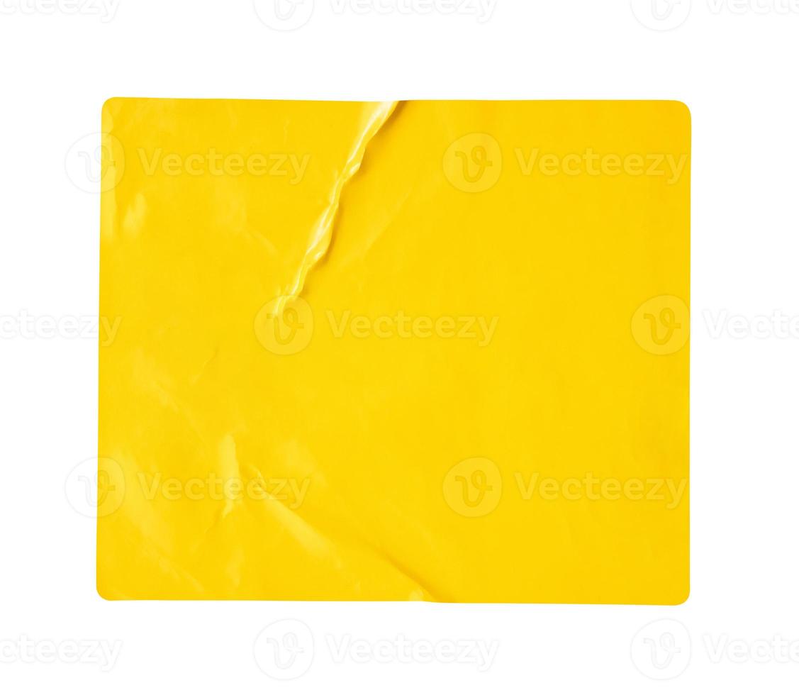 Blank yellow paper sticker label isolated on white background photo