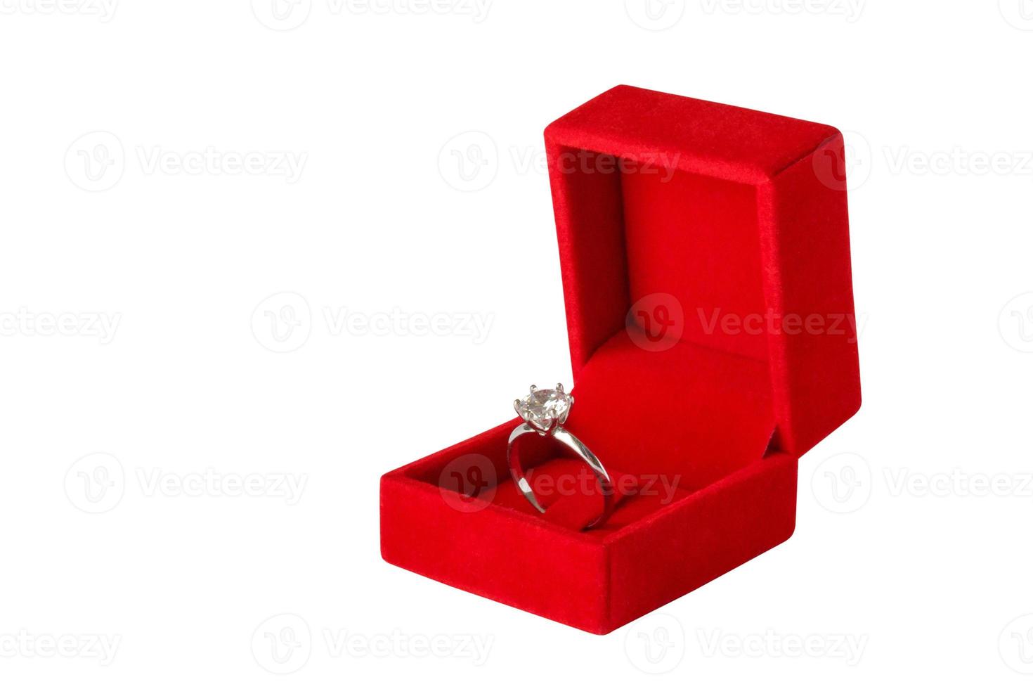 Diamond ring in jewelry gift box isolated on white background photo