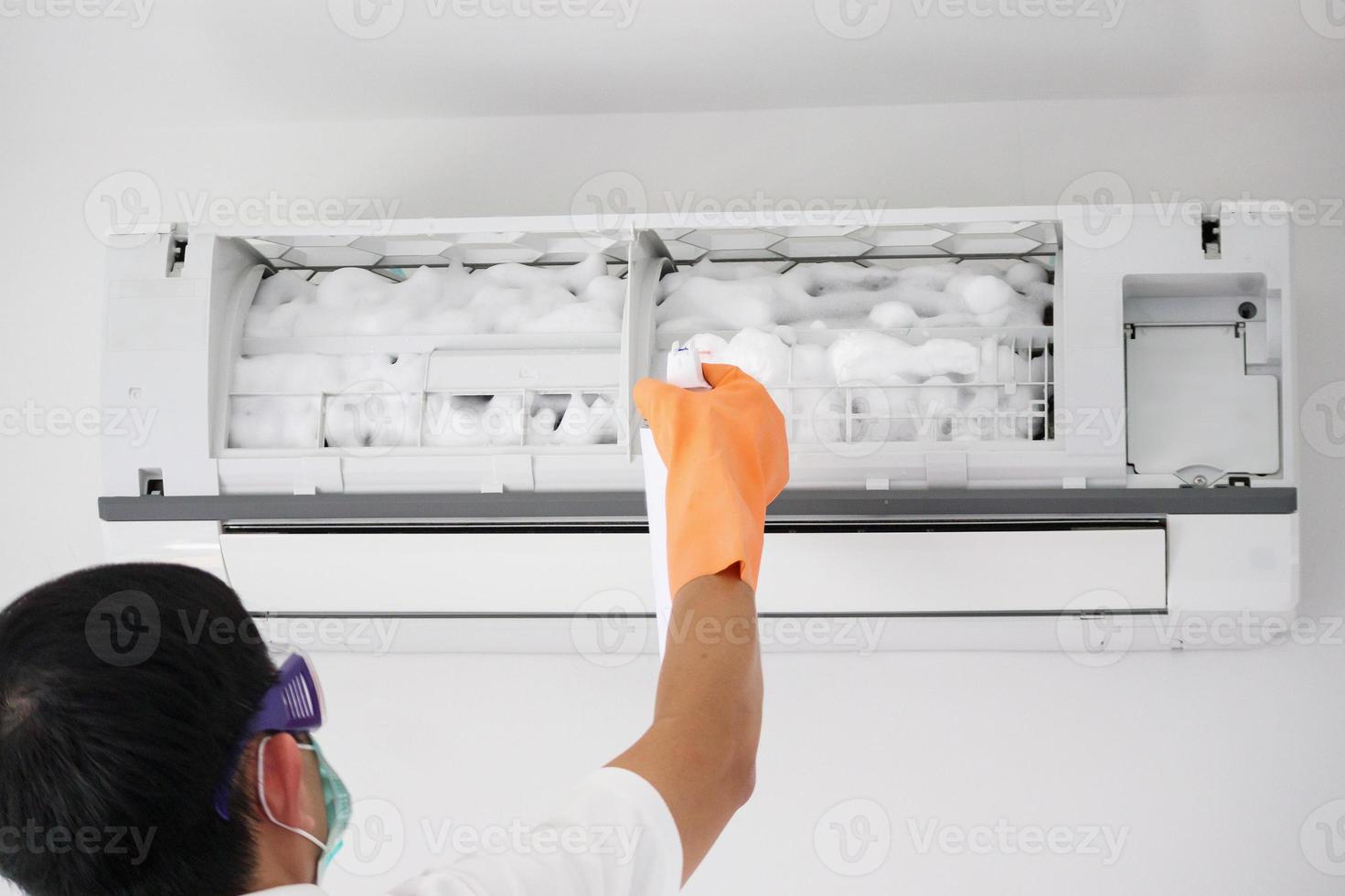 air conditioner cleaning with spray foam cleaner photo