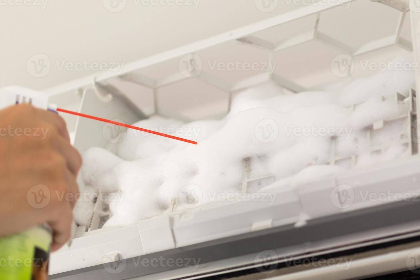 air conditioner cleaning with spray foam cleaner photo