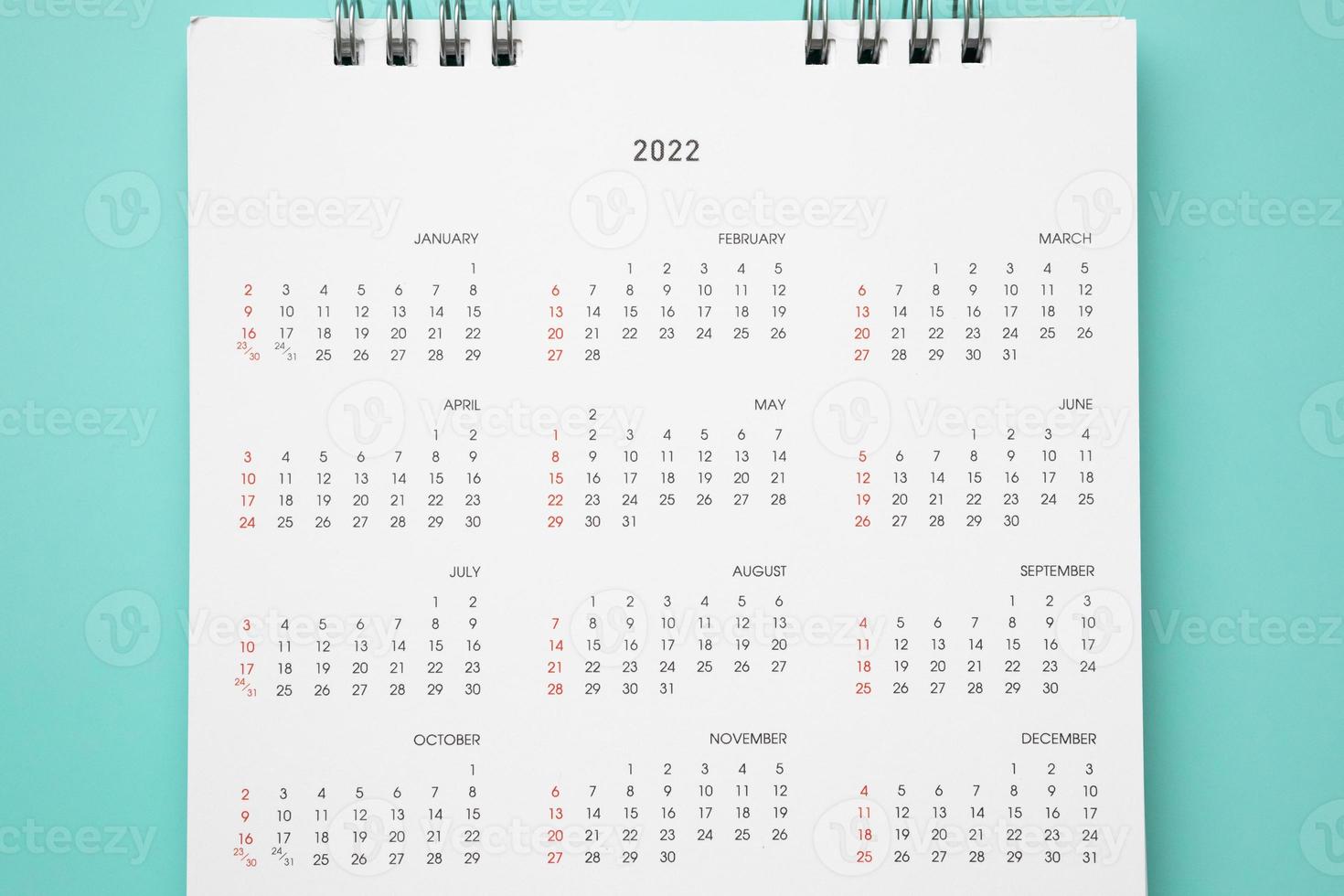 2022 calendar page on blue background business planning appointment meeting concept photo