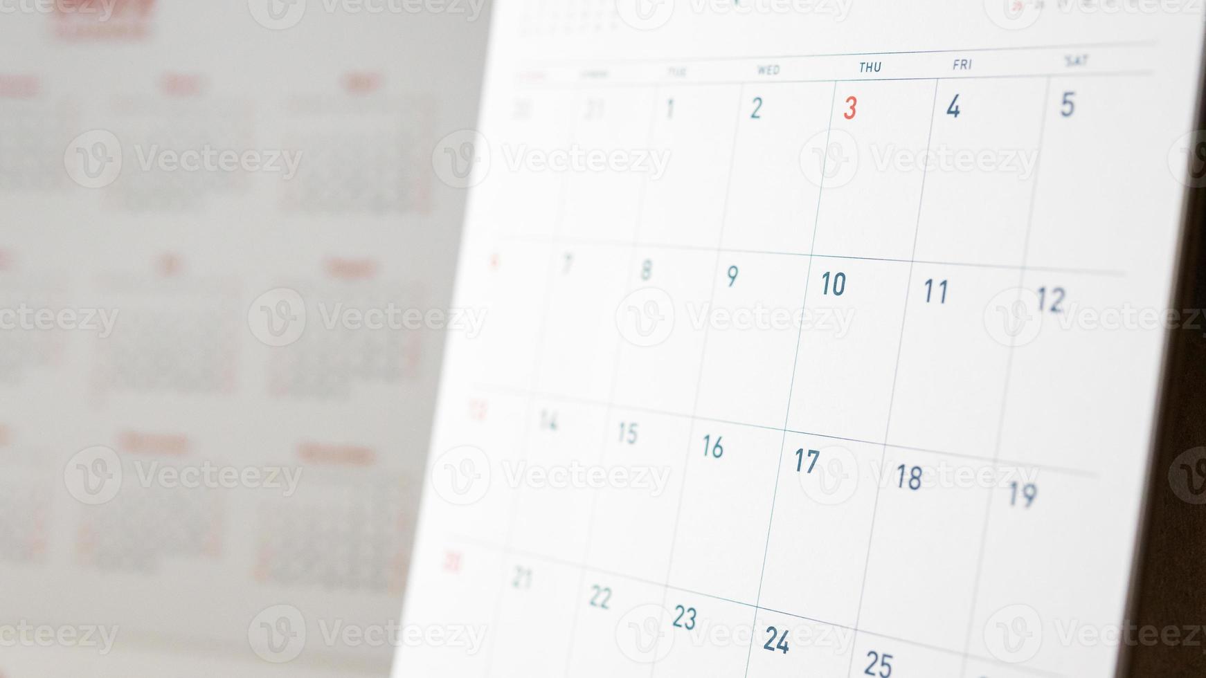 Abstract blur calendar page flipping sheet close up background business schedule planning appointment meeting concept photo