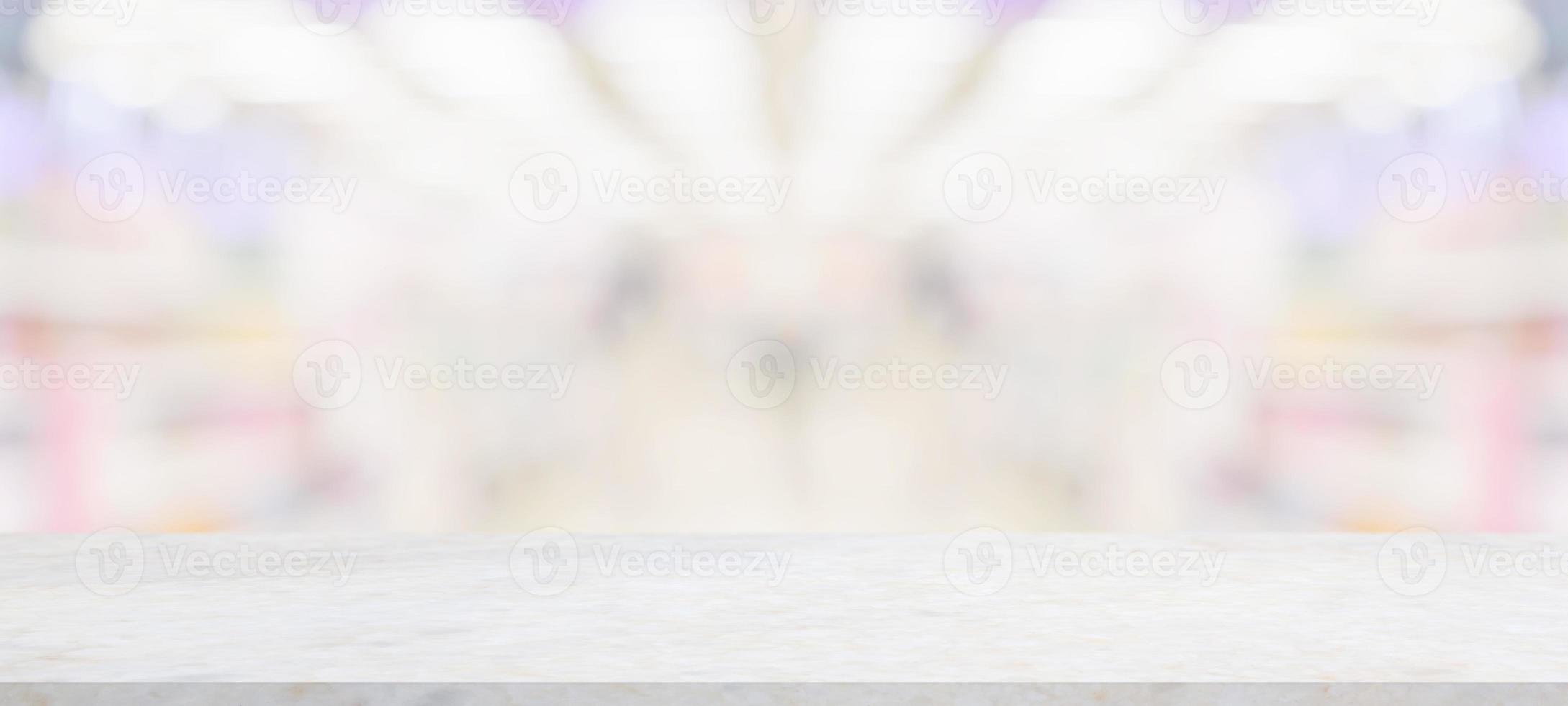 Marble table top with supermarket grocery store blurred background with bokeh light for product display photo