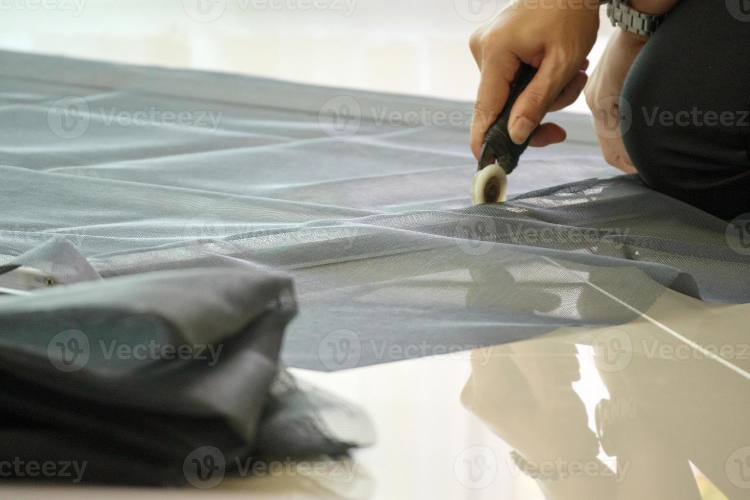 man install mosquito net wire screen on house window protection against insect photo
