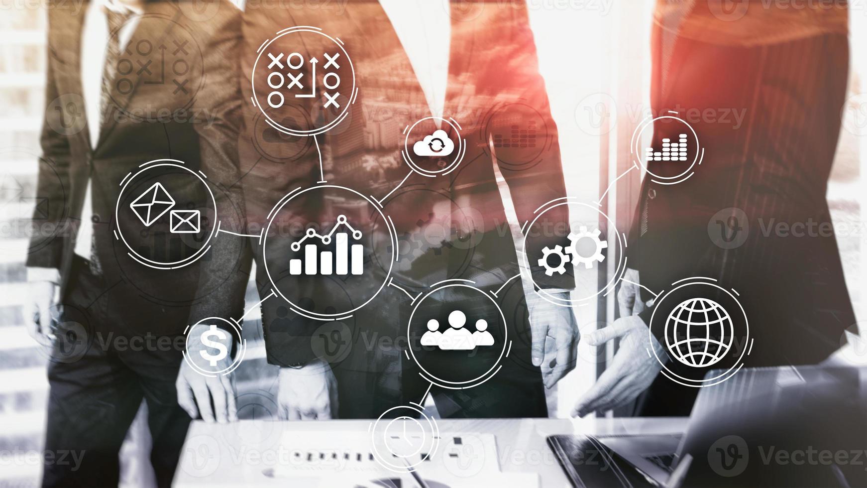 Company employees discuss a business plan. Business process automation concept on blurred backgroun photo