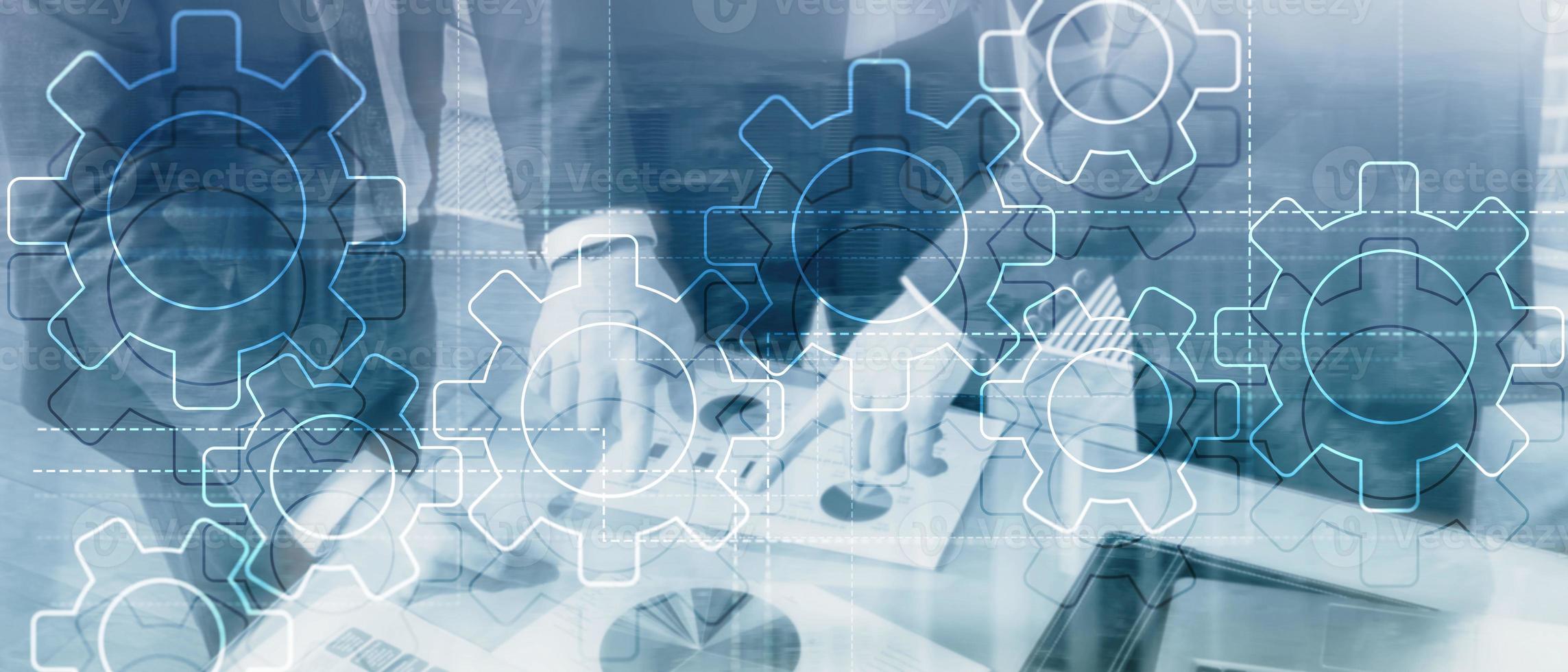 Double exposure gears mechanism on blurred background. Business and industrial process automation concept photo
