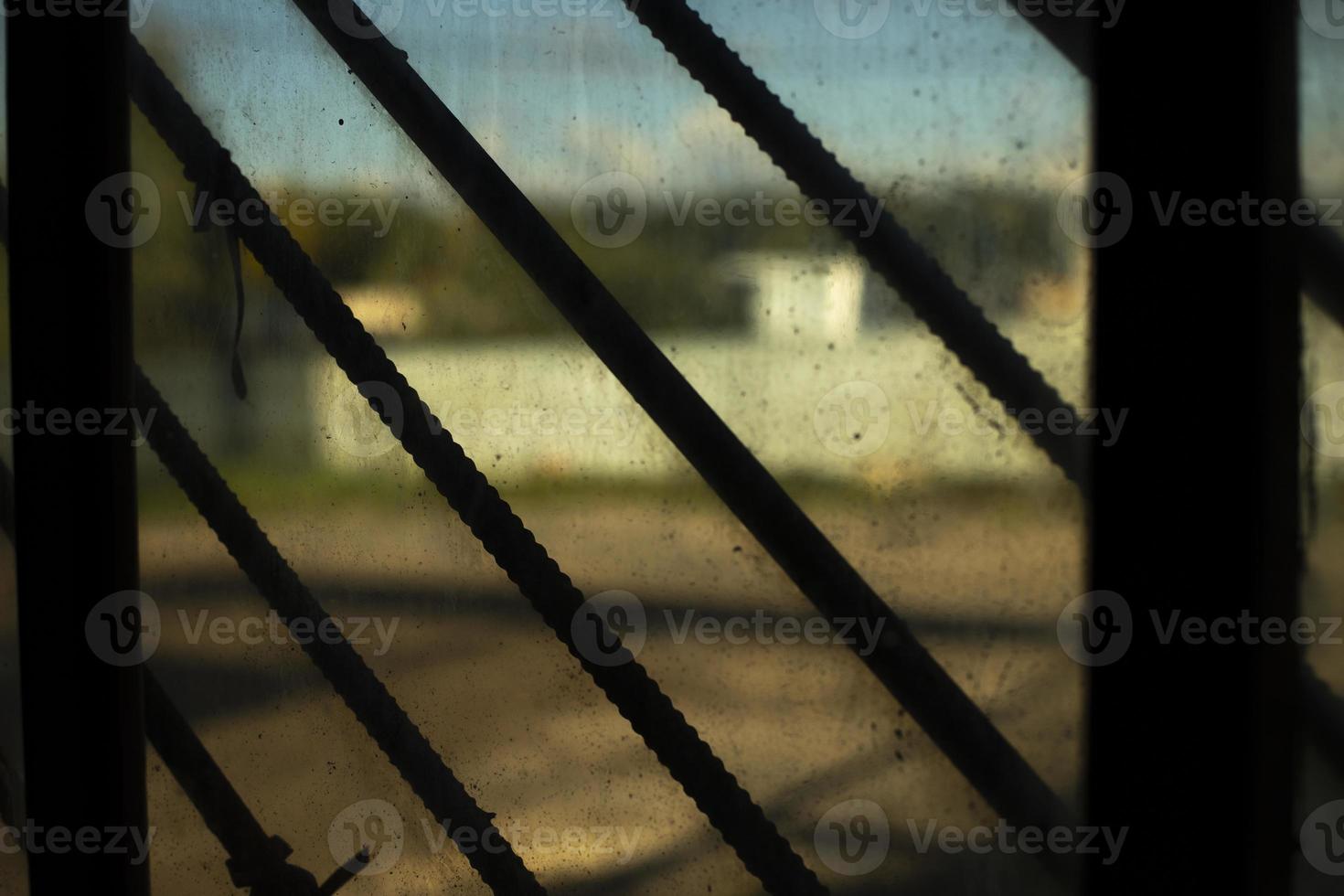 Grille on window. Steel grating. Old window inside view. Interior details. photo