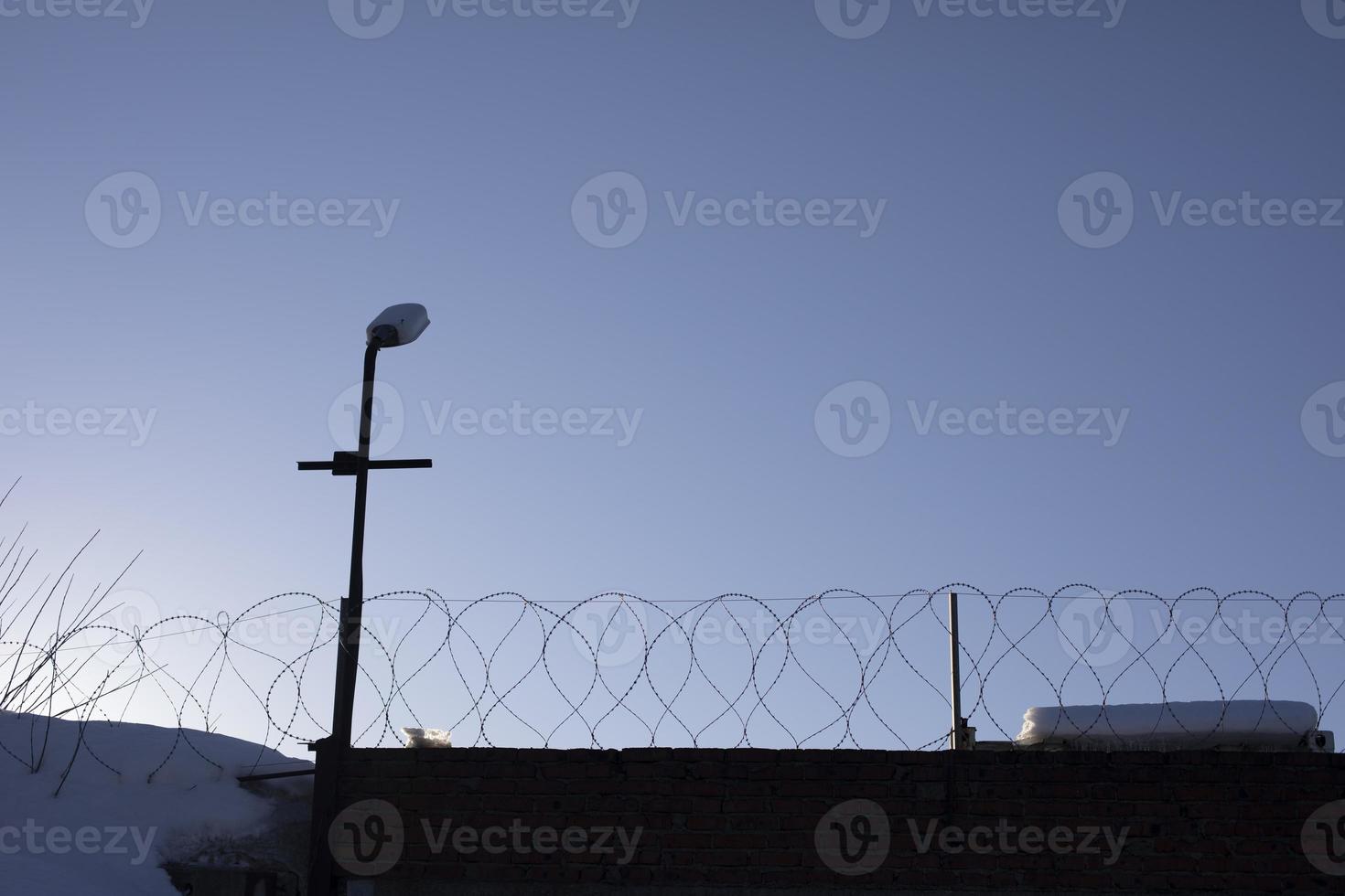 Barbed wire fence. Details of industrial area. photo