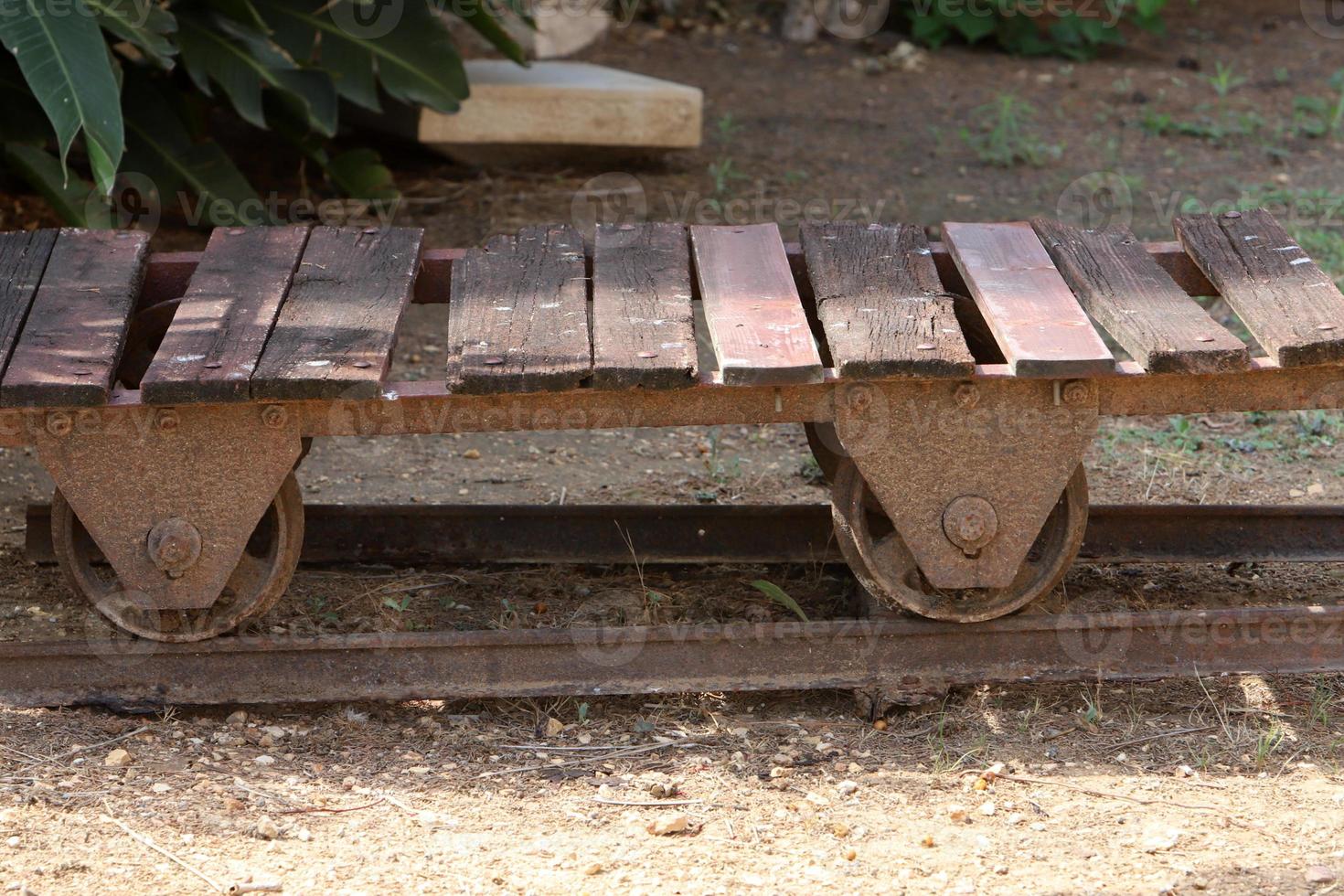 Old agricultural machinery stands on the street in Israel and rusts photo