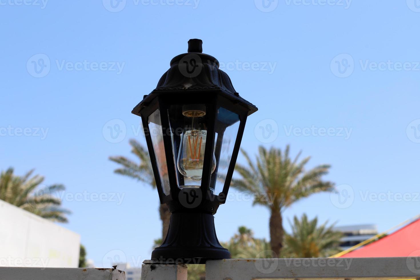 Lantern to illuminate the city street at night. photo