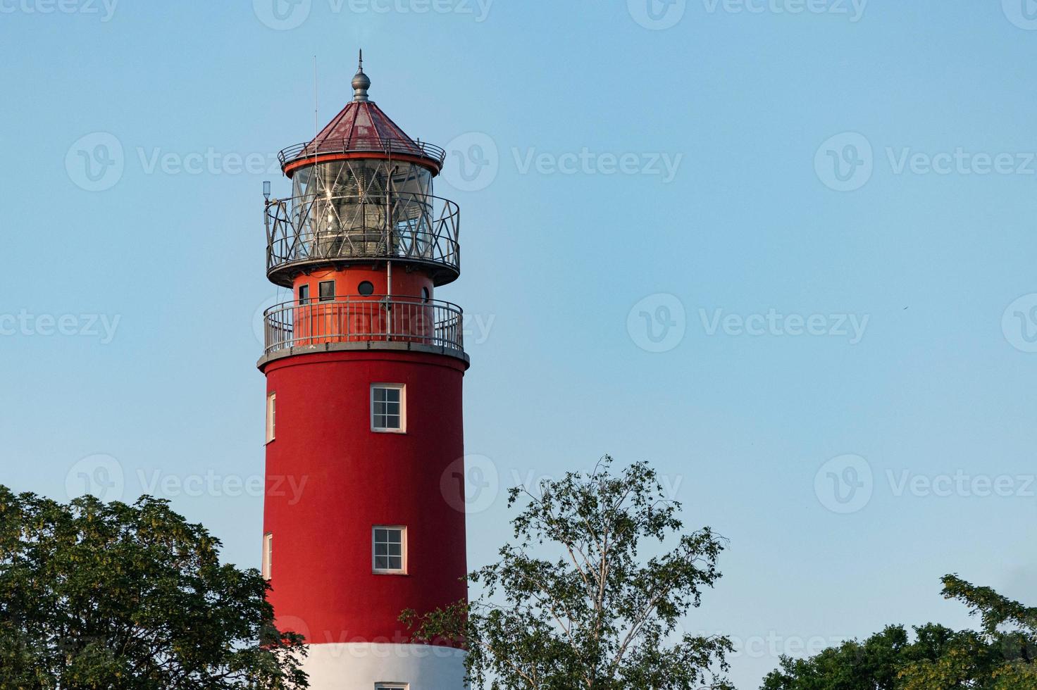 Lighthouse in seaport. Beautiful russian Baltiysk beacon. Scenery blue sky, copy space. photo