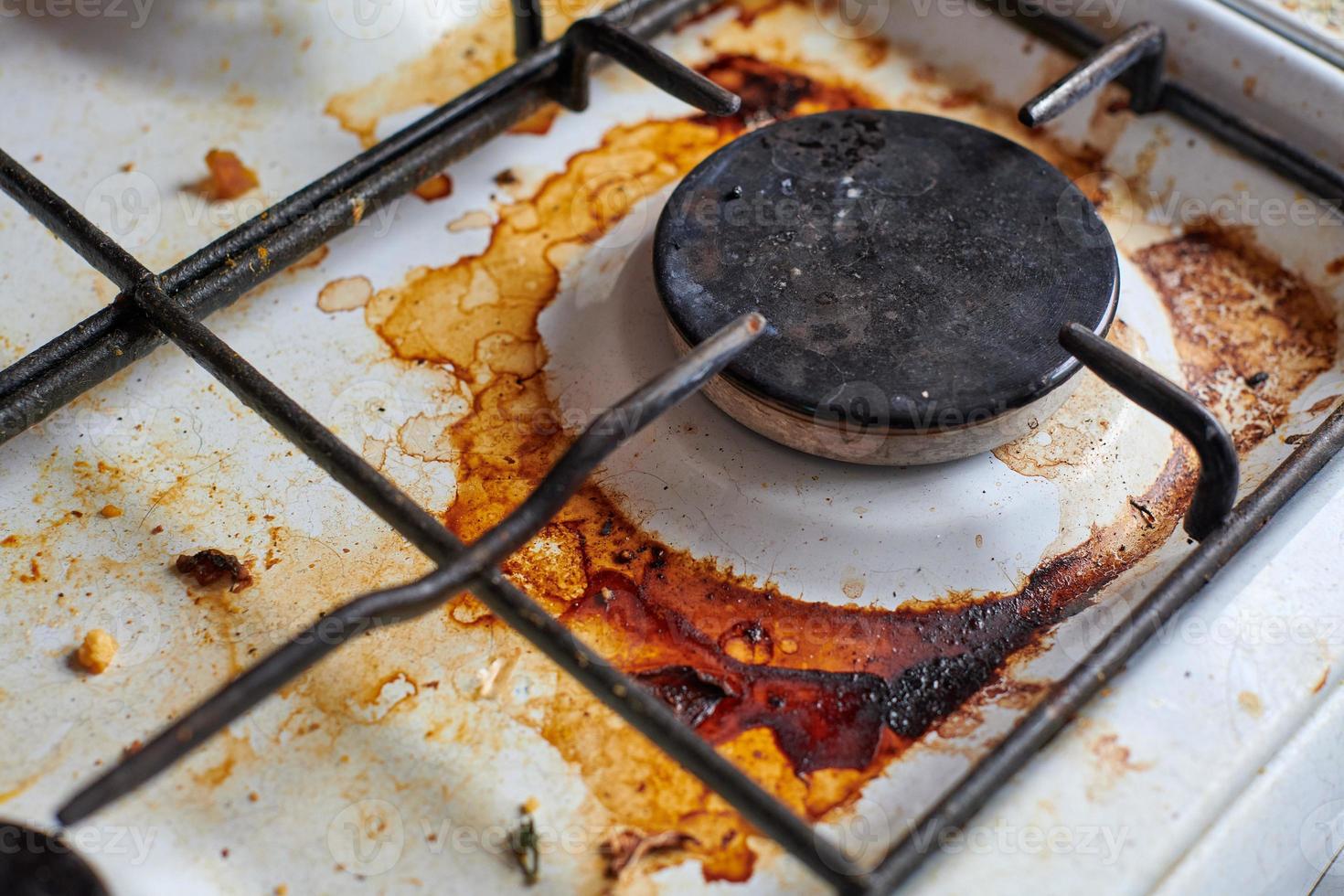 Dirty stove with food leftovers photo