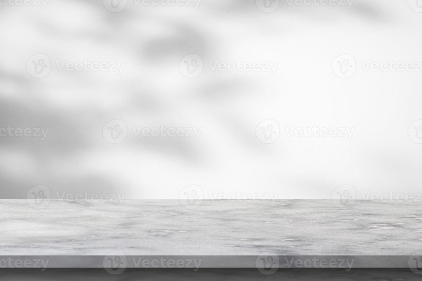 Marble table with tree shadow drop on white wall background for mockup product display photo