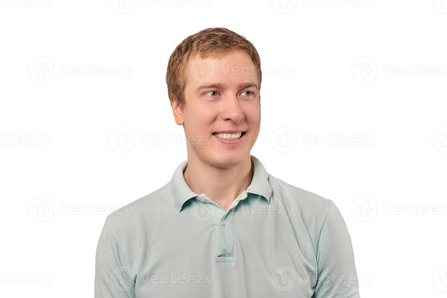 Portrait of funny young man in mint Polo T-shirt isolated on white background, handsome happy man photo
