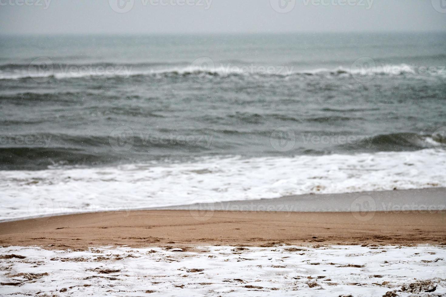 Baltic sea in winter, stormy, snowy and gloomy photo