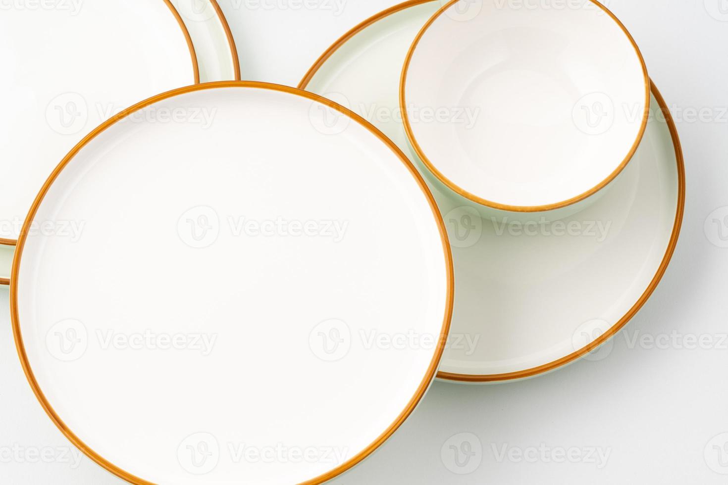 A set of ceramic tableware isolated on white background photo