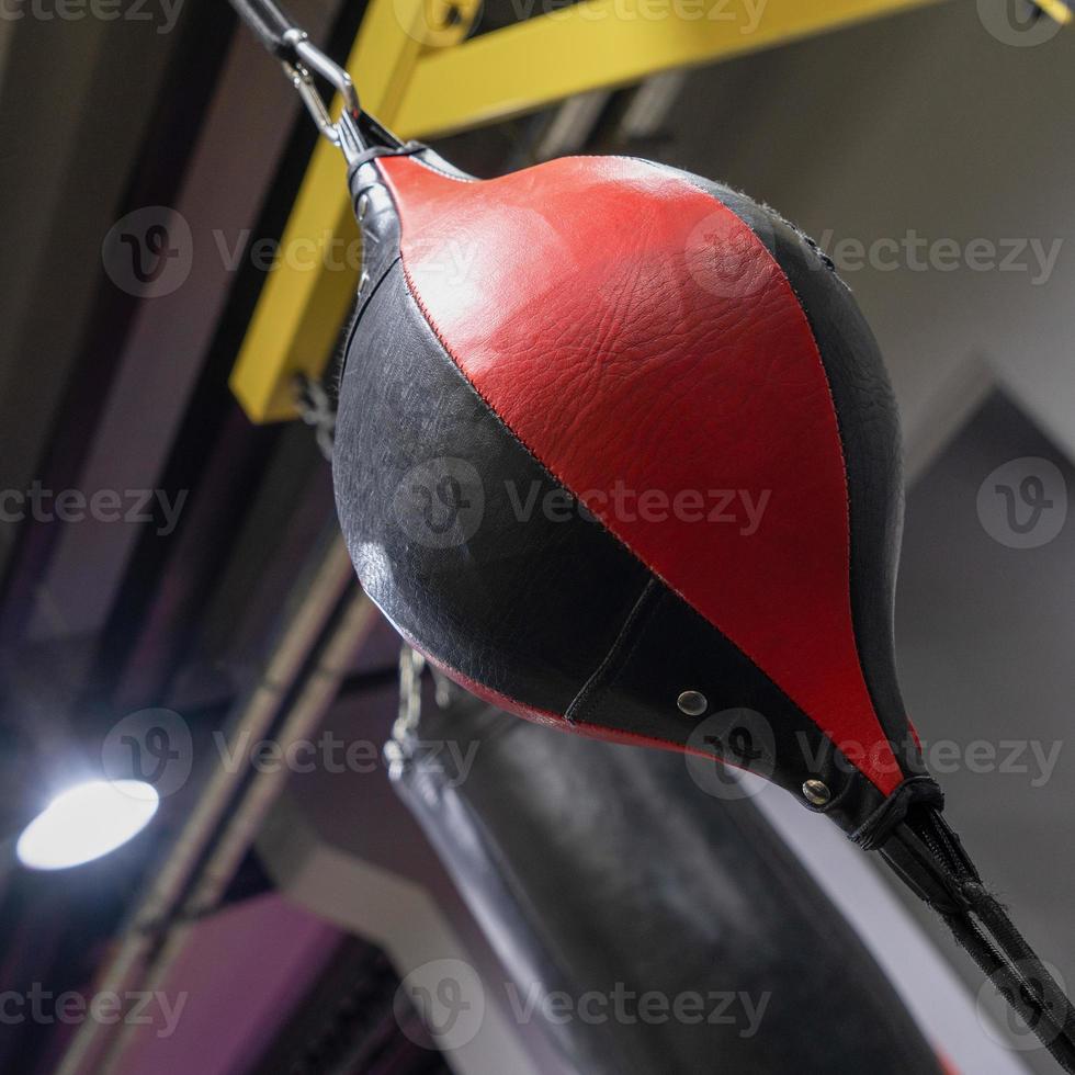 A vertical closeup of a boxing punching bag in the sports complex photo