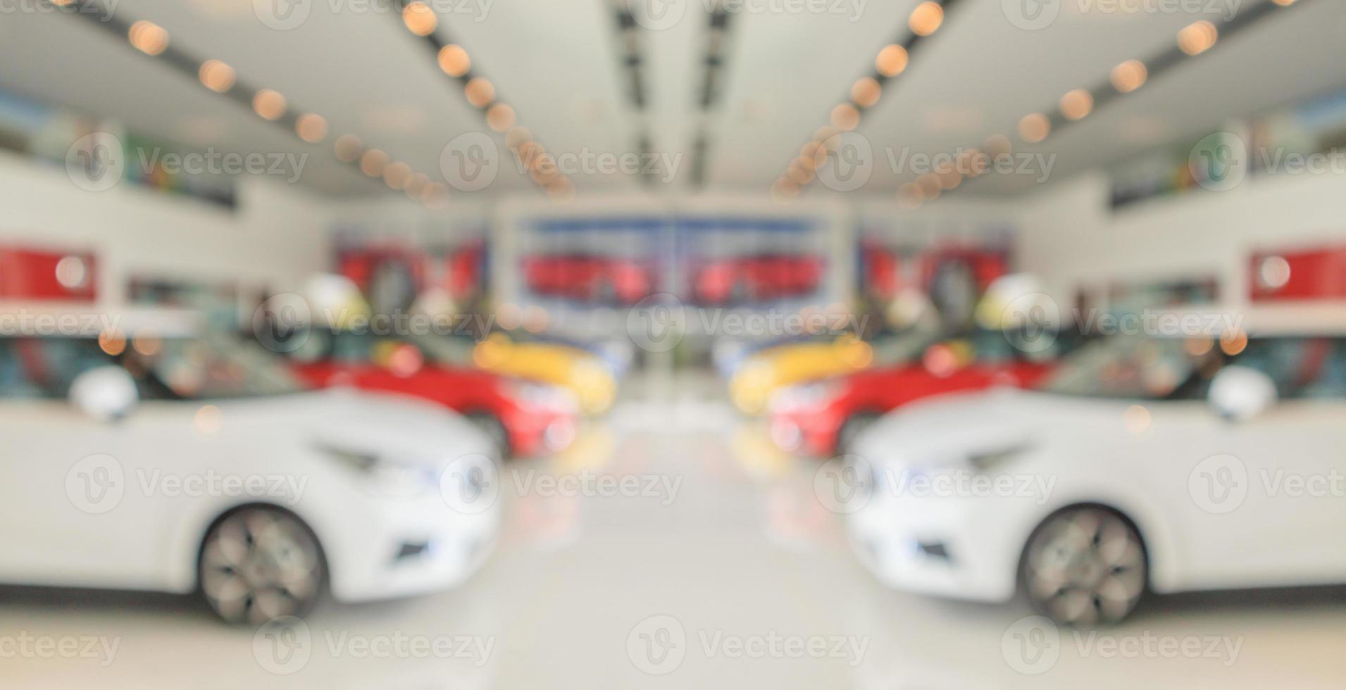 new cars in showroom interior blurred abstract background photo