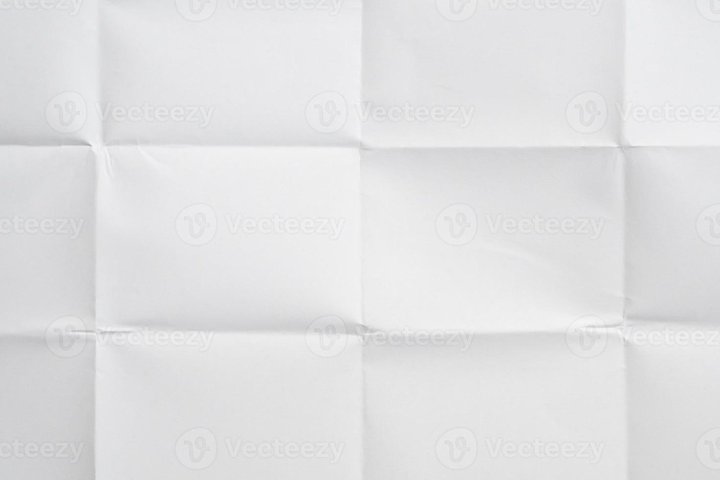 White folded and wrinkled paper texture background photo