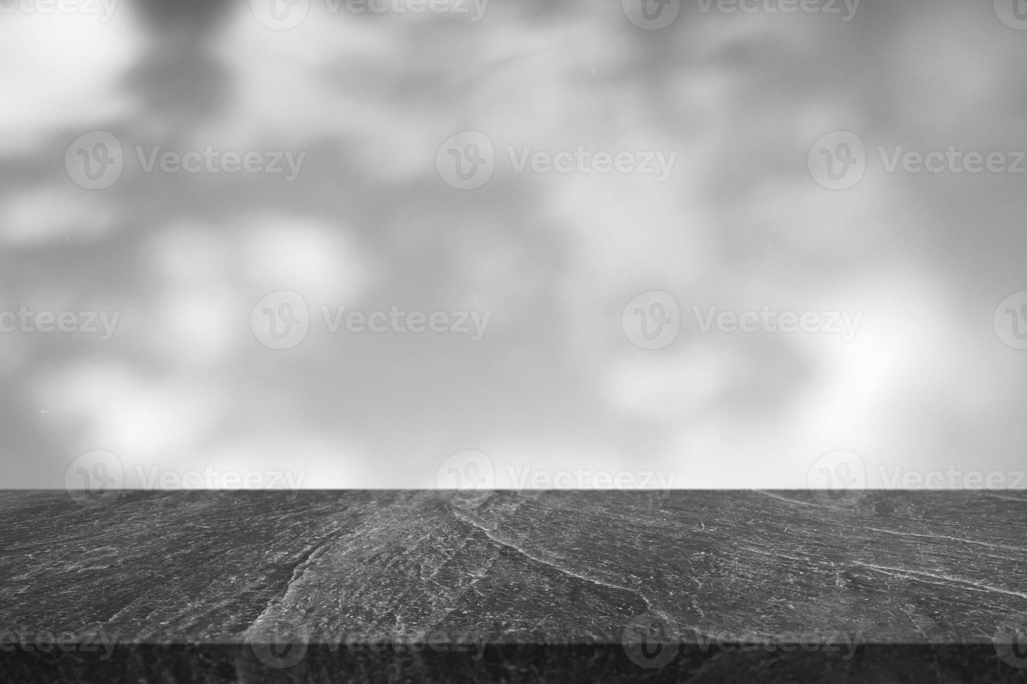 Marble table with tree shadow drop on white wall background for mockup product display photo