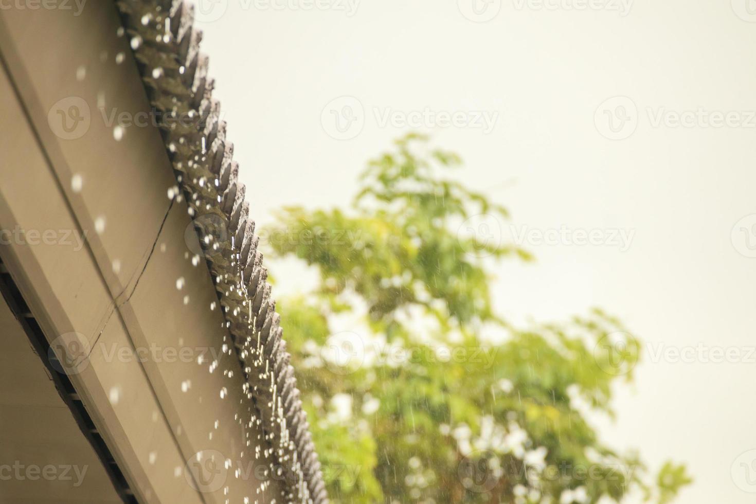 rain falling down from the house roof photo