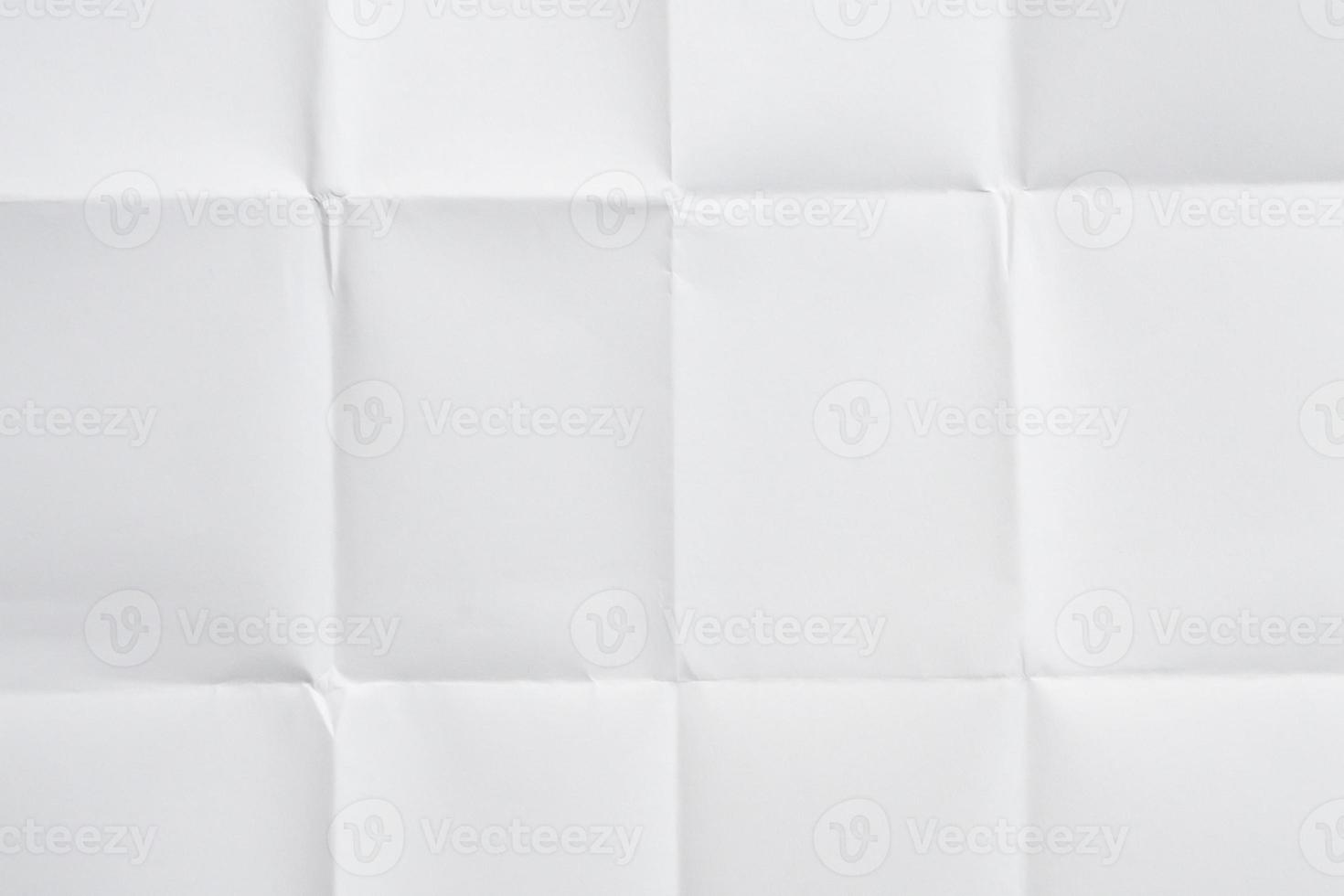 White folded and wrinkled paper texture background photo
