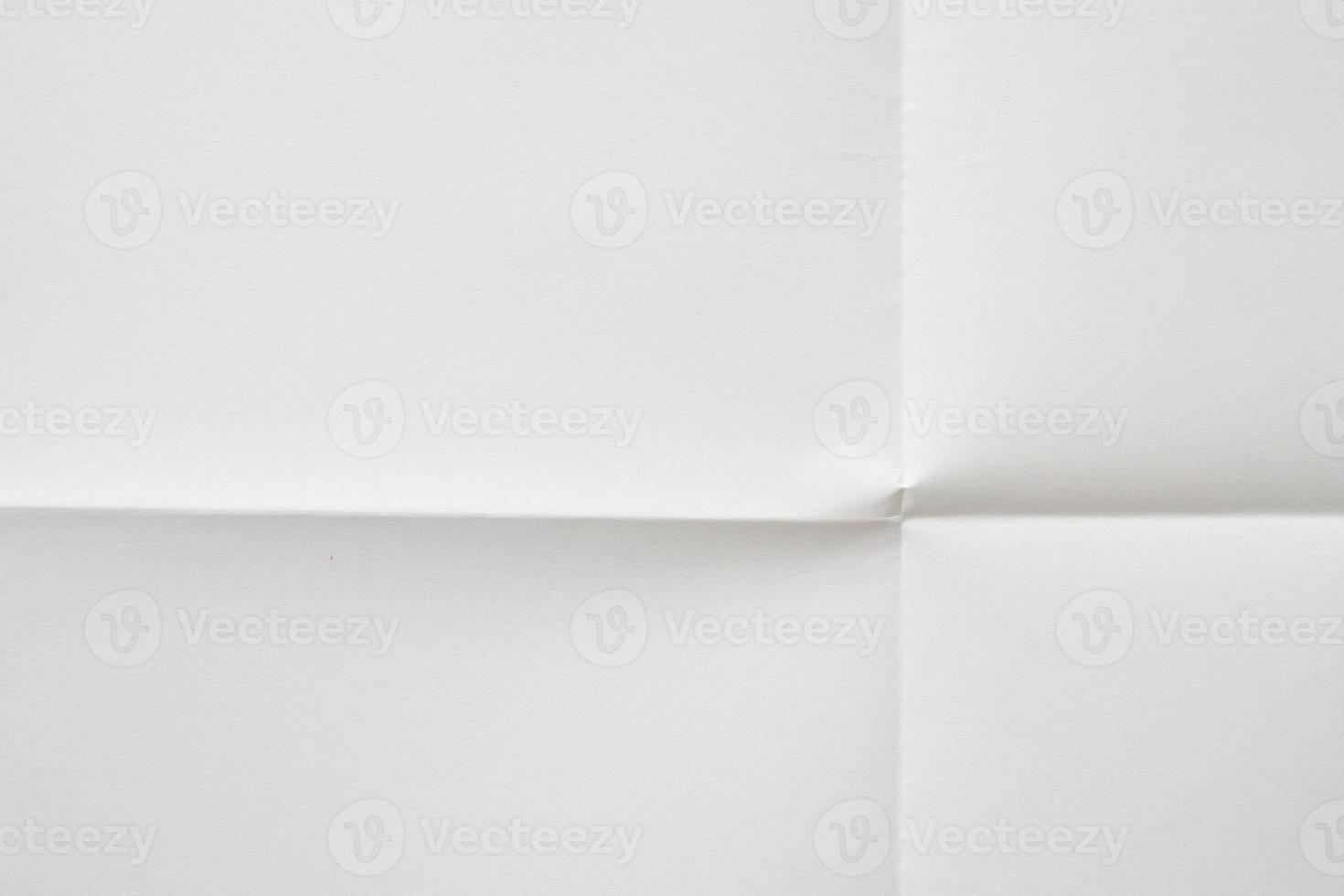 White folded and wrinkled paper texture background photo