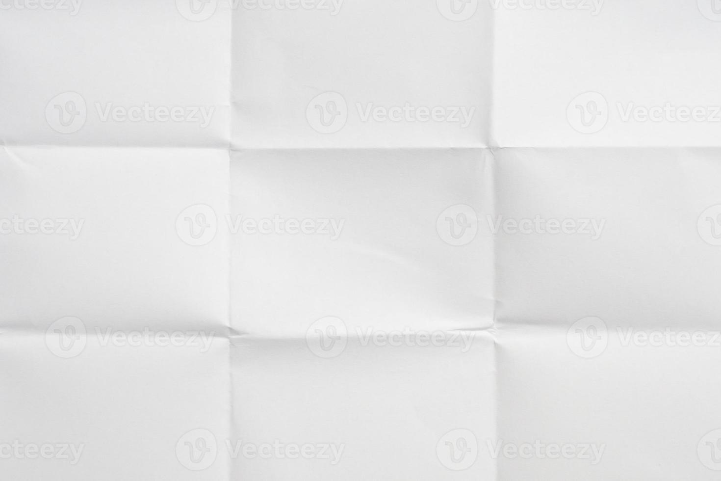 White folded and wrinkled paper texture background photo