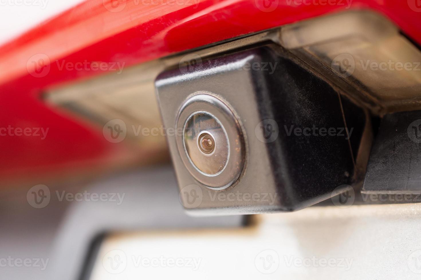 Red car rear view camera close up for parking assistance photo