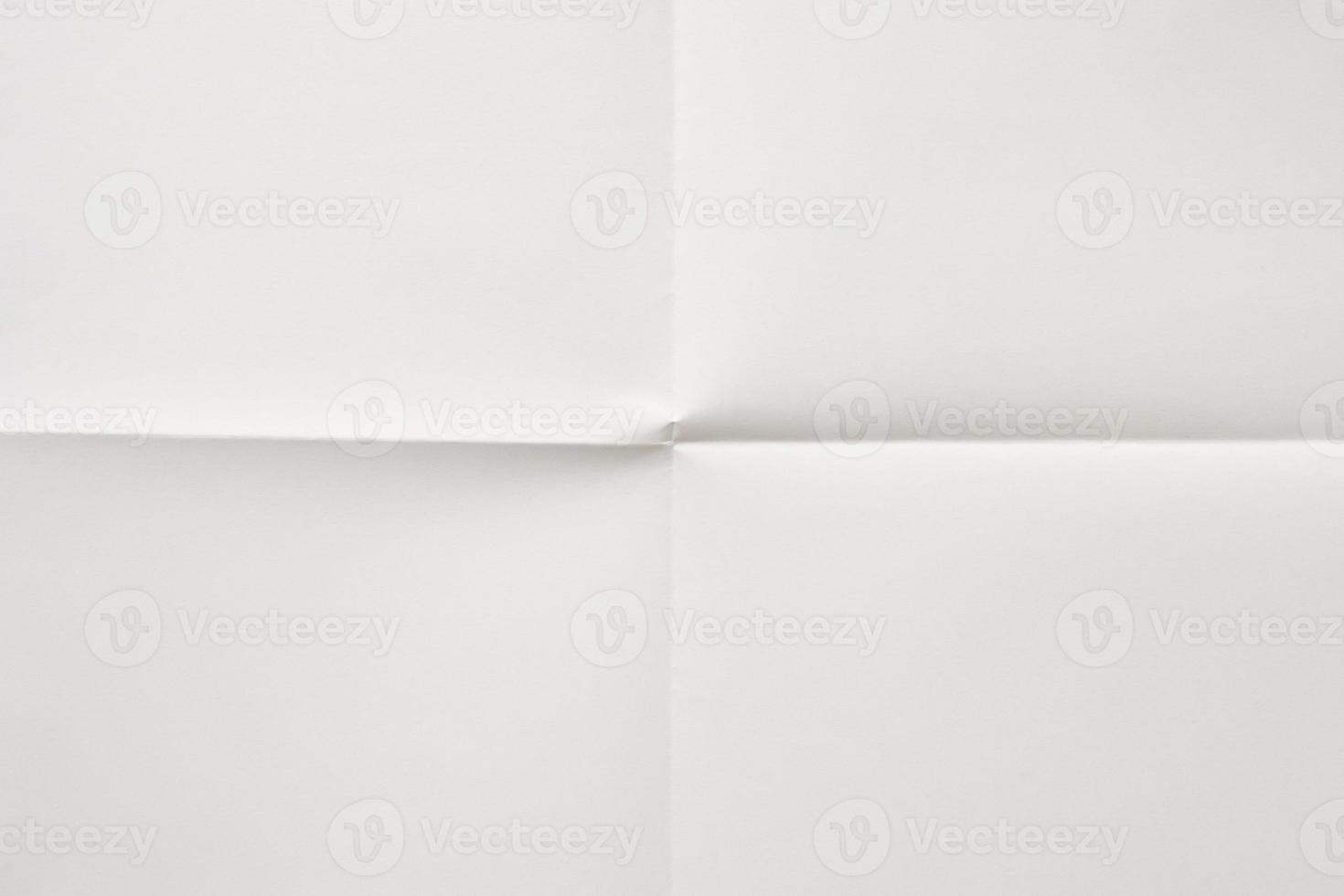 White folded and wrinkled paper texture background photo