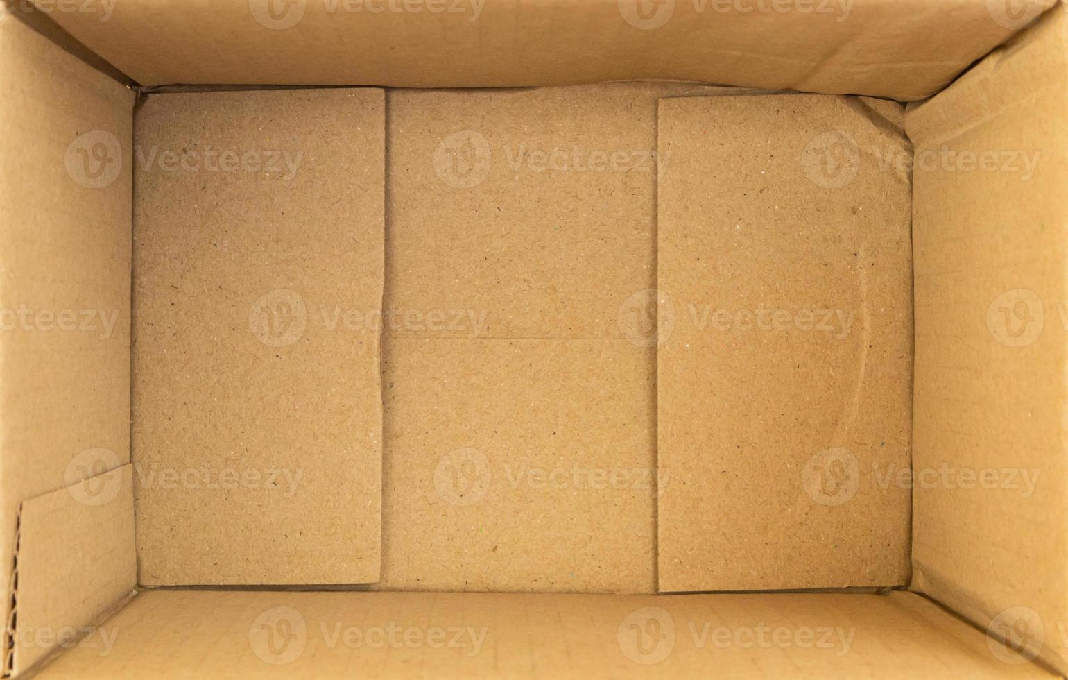 Open empty brown cardboard box background top view photo