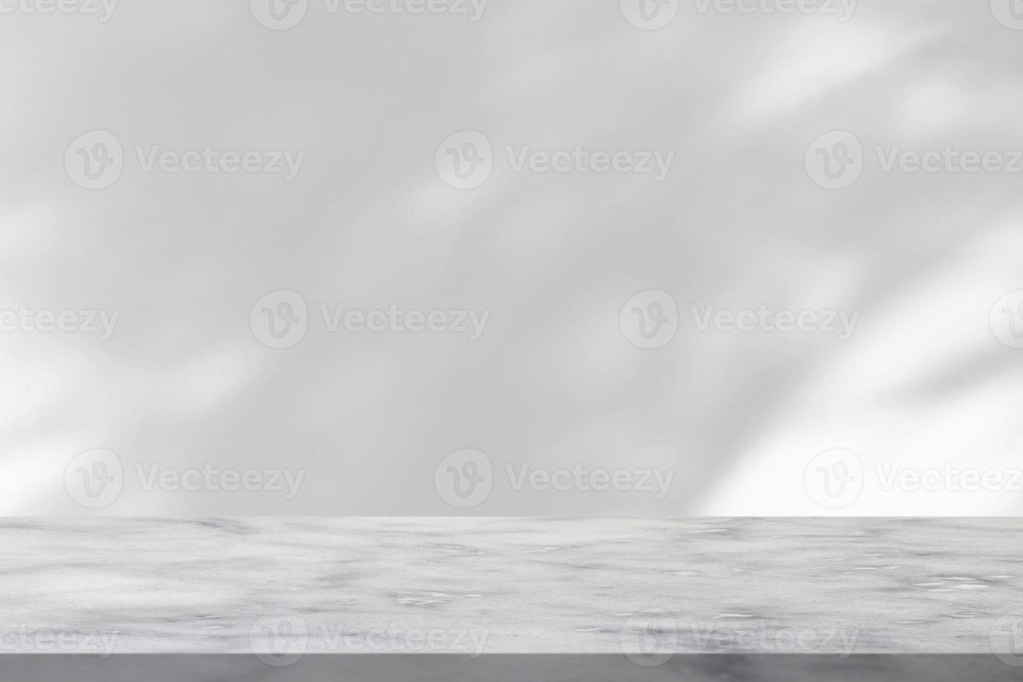 Marble table with tree shadow drop on white wall background for mockup product display photo
