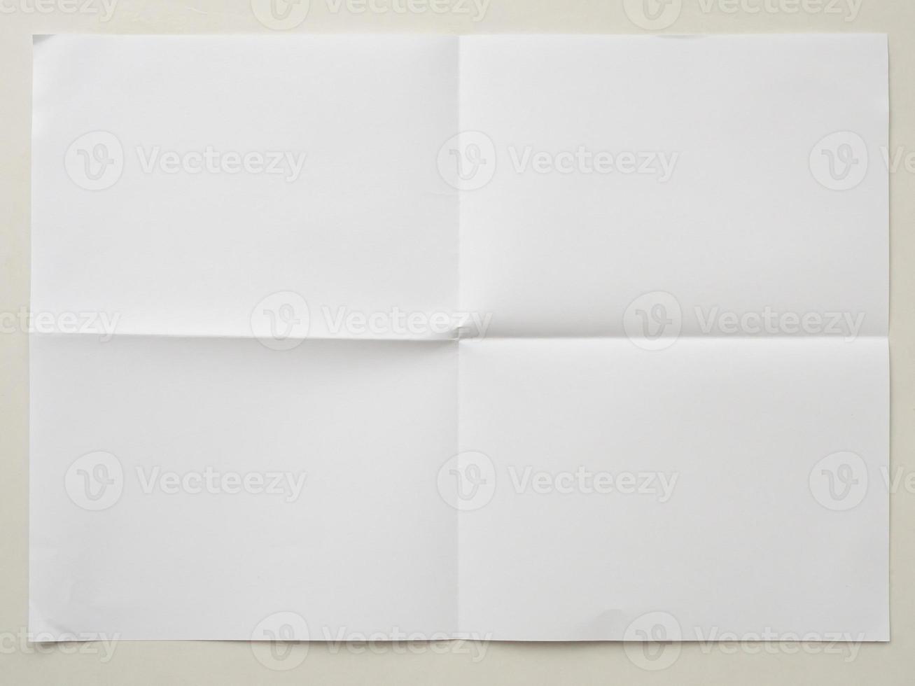 White folded and wrinkled paper on white background photo