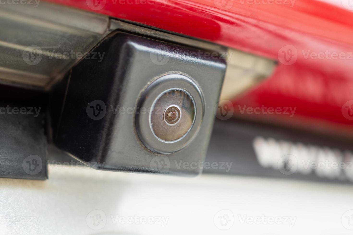 Red car rear view camera close up for parking assistance photo