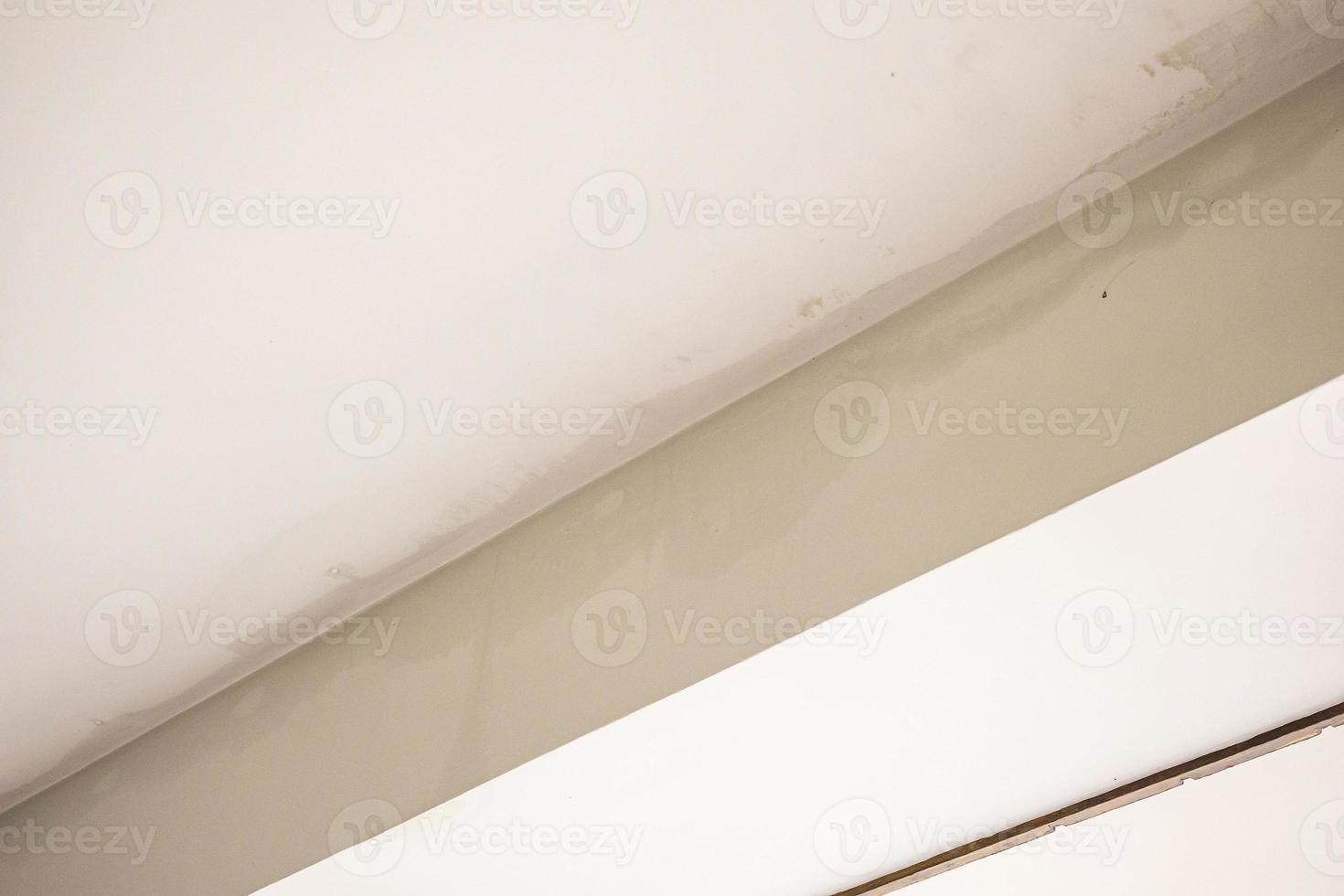 Rain water leak damaged ceiling close up photo