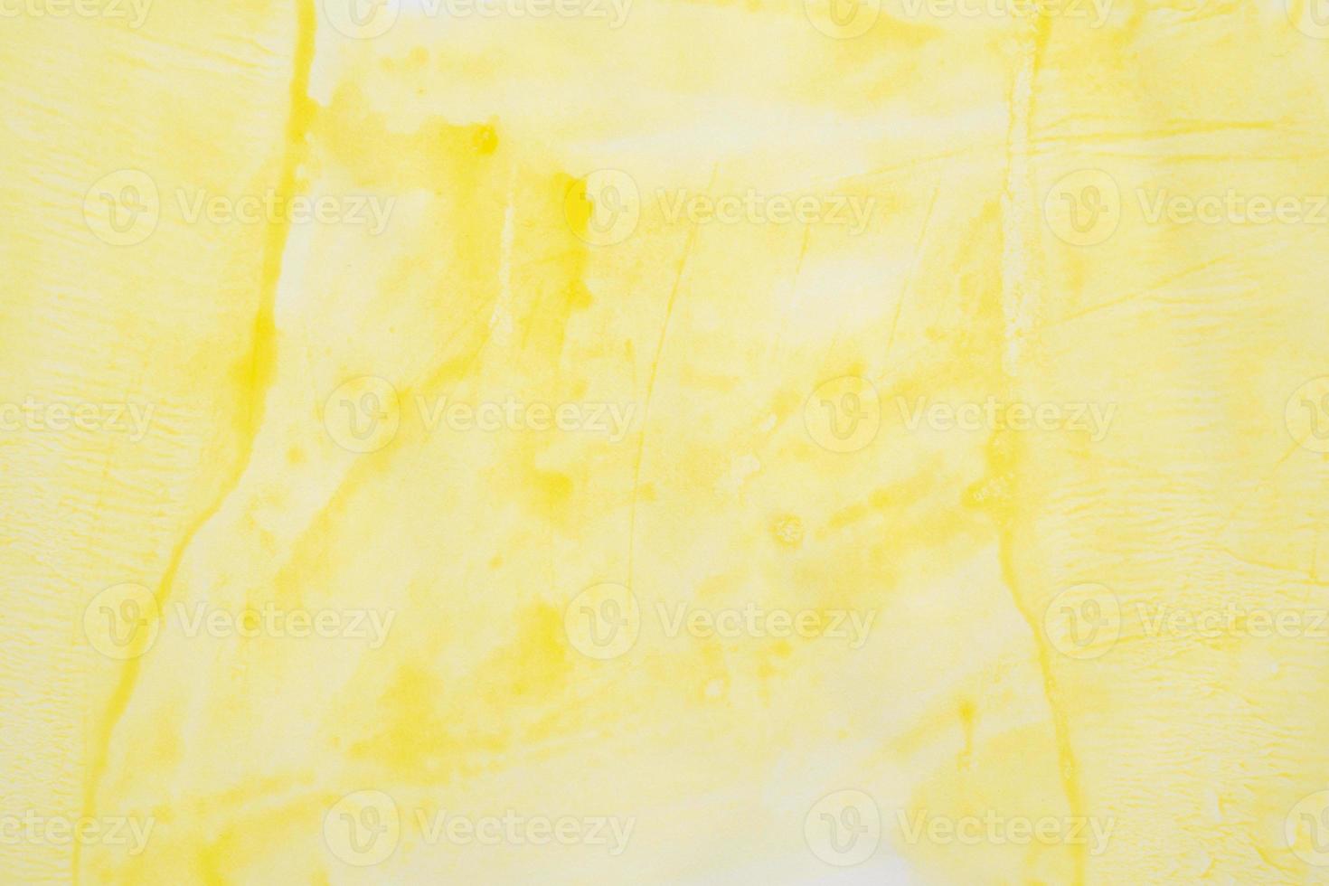 Abstract yellow watercolor background texture close up photo