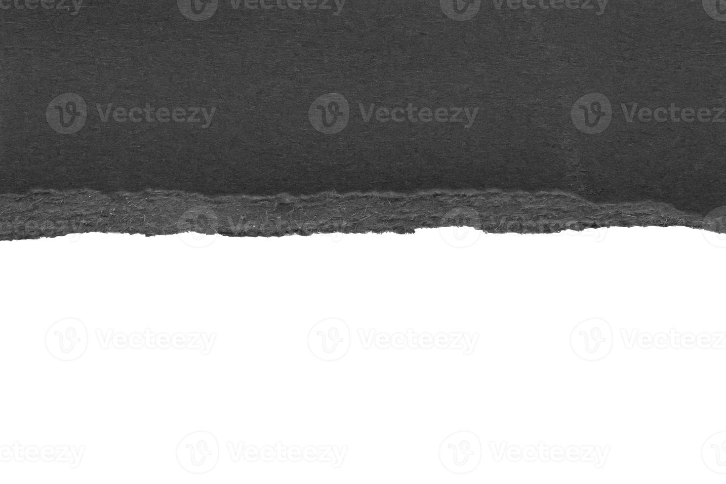 Black ripped paper torn edges strips isolated on white background photo