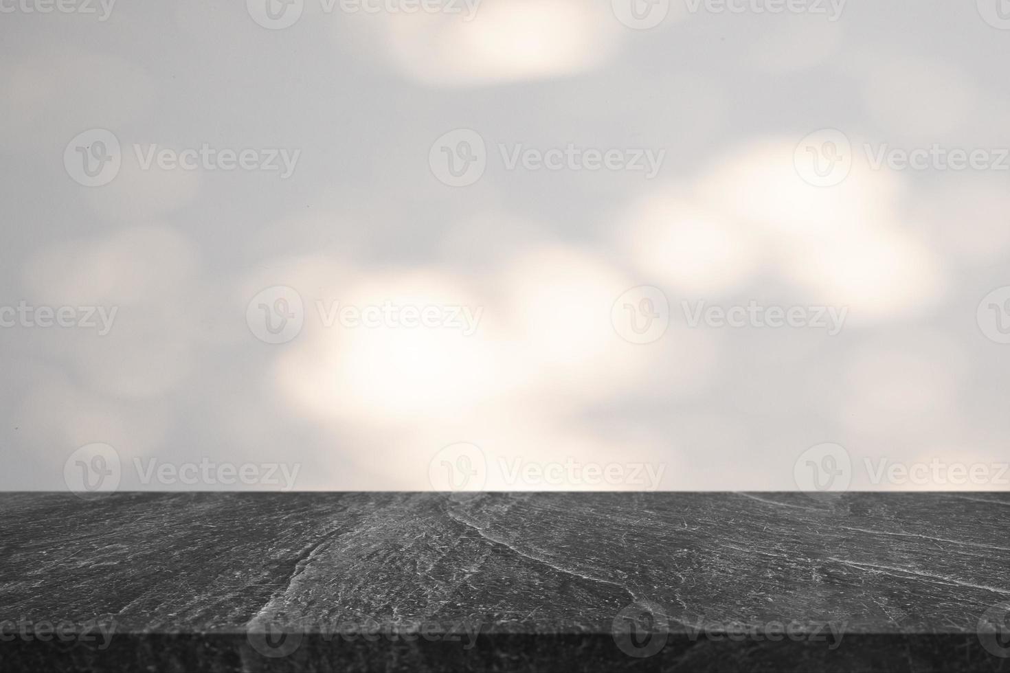 Marble table top with tree shadow drop on white wall background for mockup product display photo