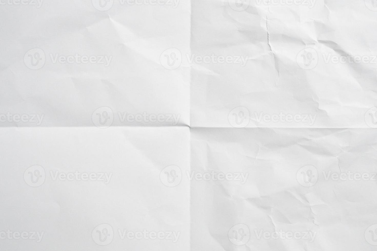 White folded and wrinkled paper texture background photo