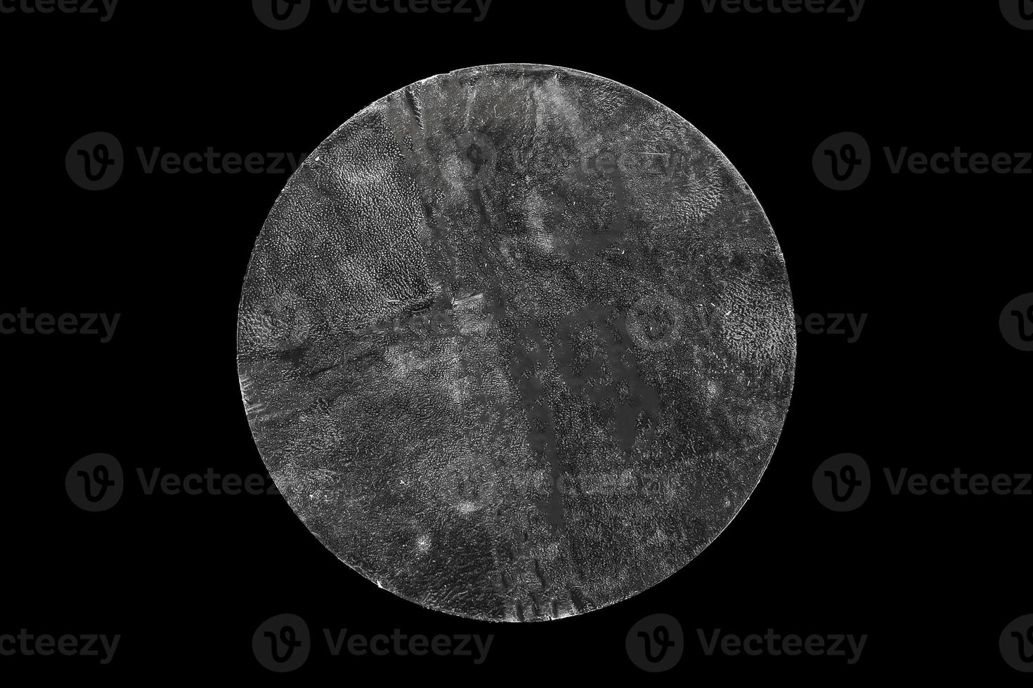 transparent adhesive round plastic sticker label isolated on black background photo