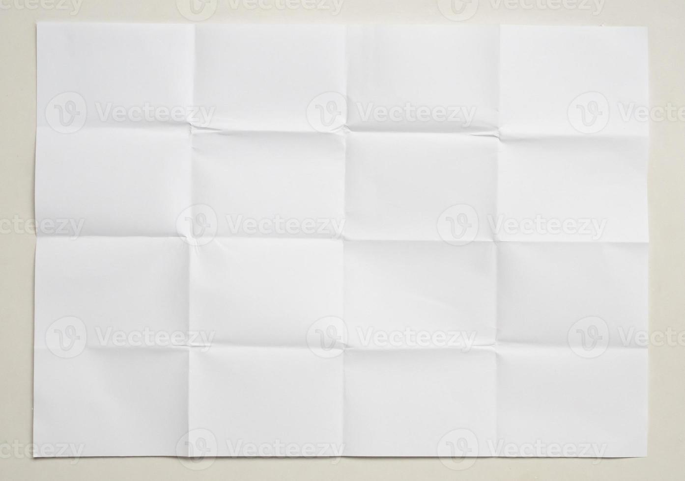 White folded and wrinkled paper on white background photo