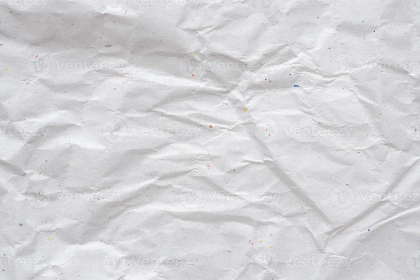 white crumpled and creased recycle paper texture background photo