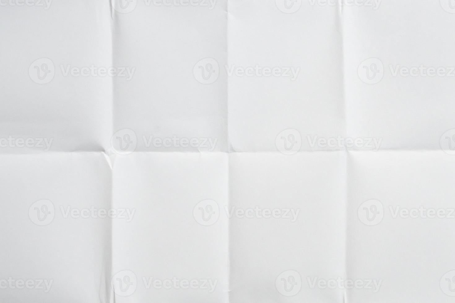 White folded and wrinkled paper texture background photo