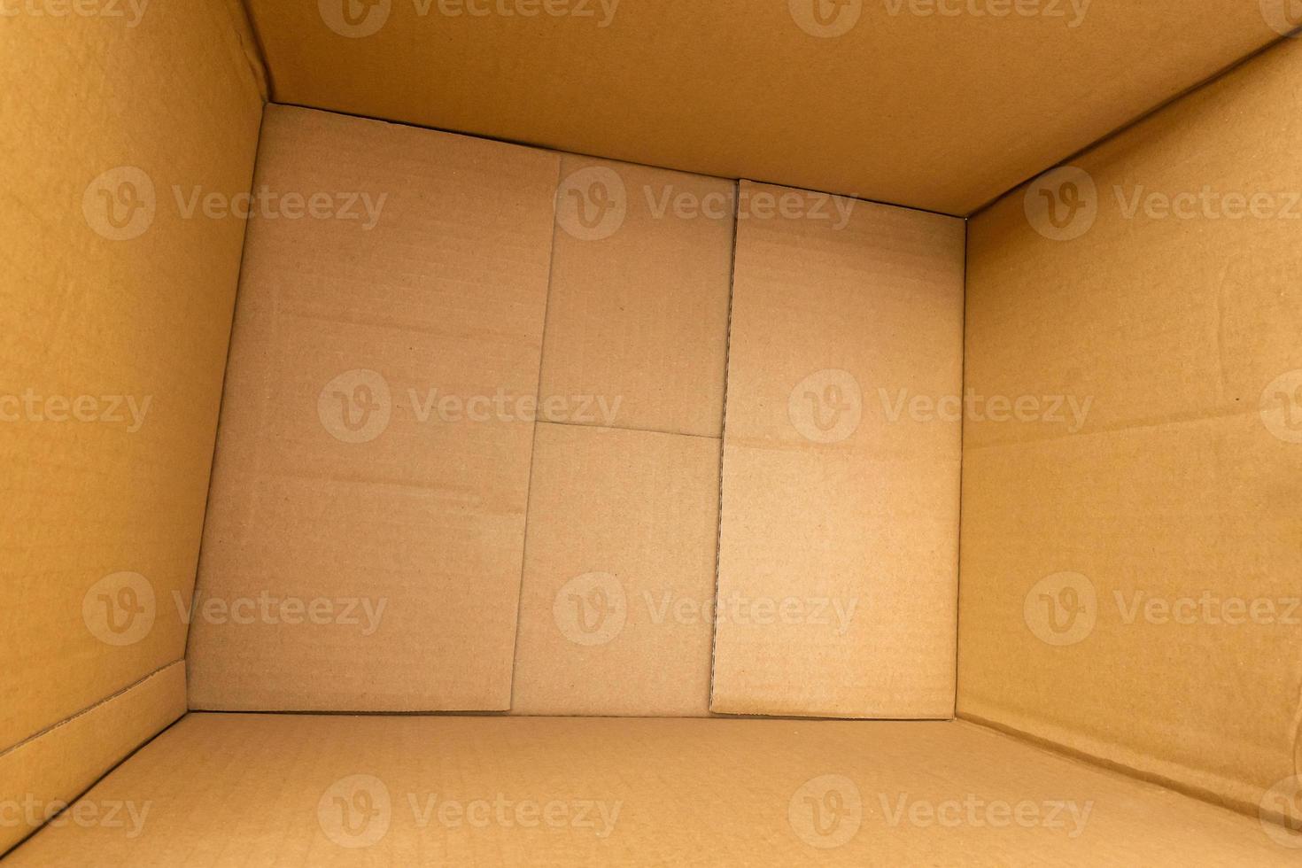Open empty brown cardboard box background top view photo