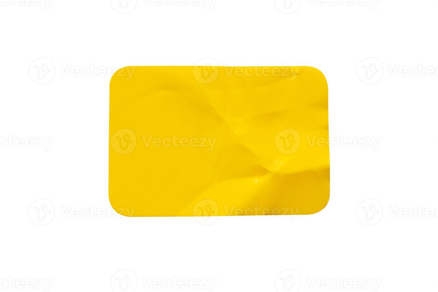 Yellow plastic sticker label isolated on white background photo