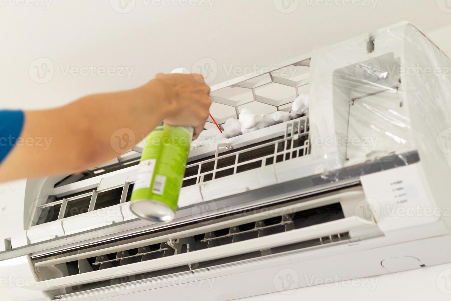 air conditioner cleaning with spray foam cleaner photo