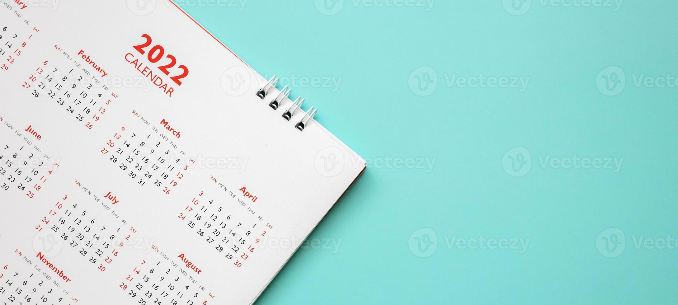 2022 calendar page on blue background business planning appointment meeting concept photo